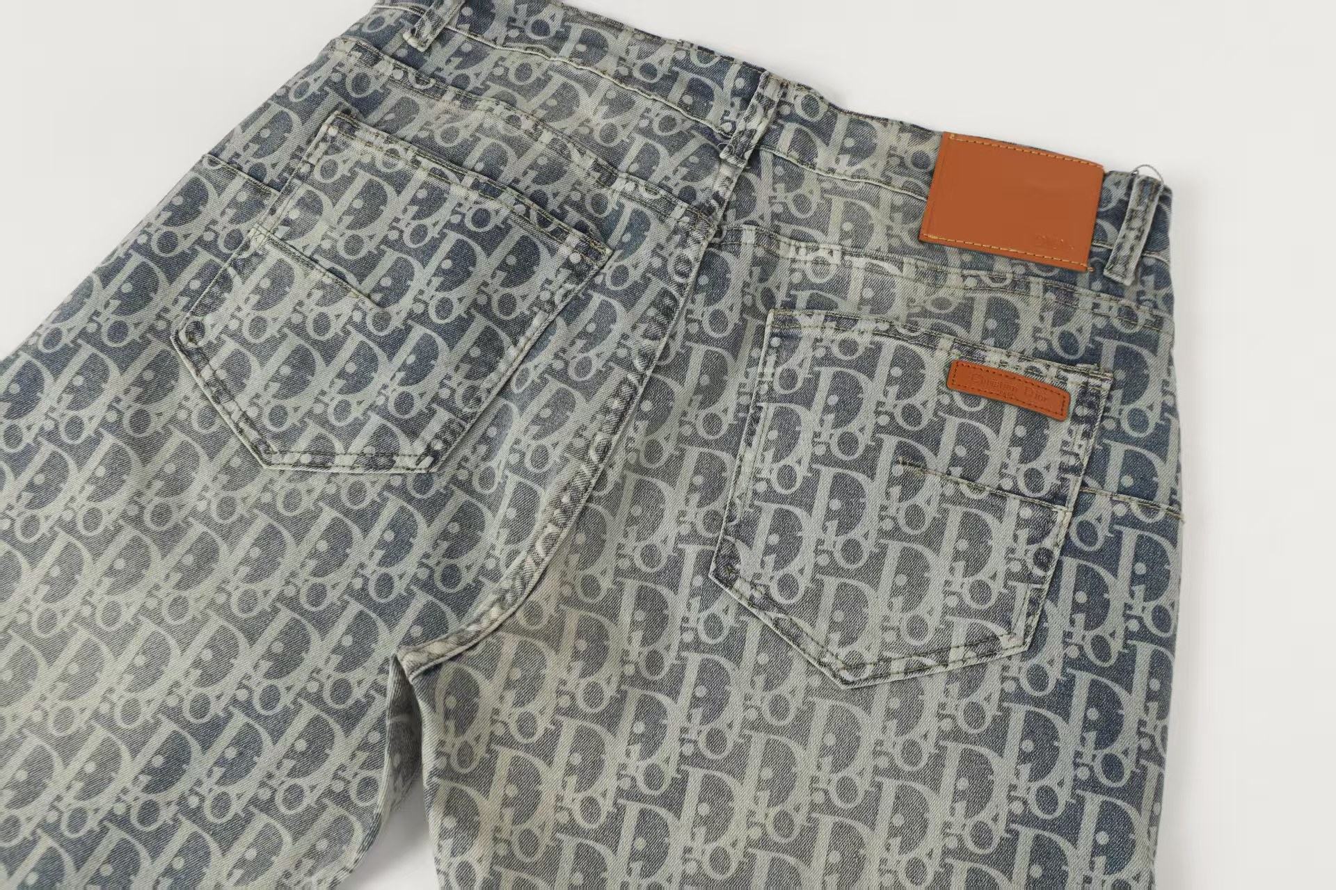 Oblique All-Over Print Faded Denim Jeans | Blue