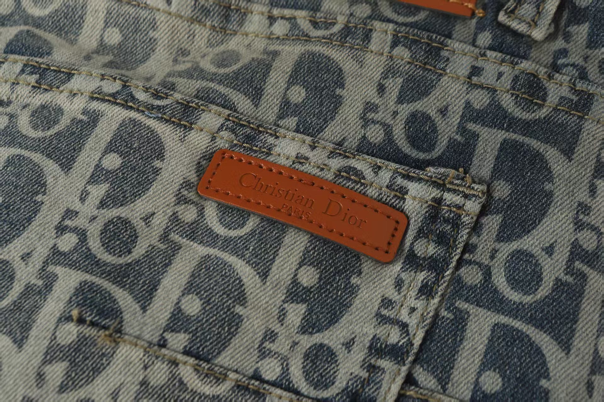Oblique All-Over Print Faded Denim Jeans | Blue