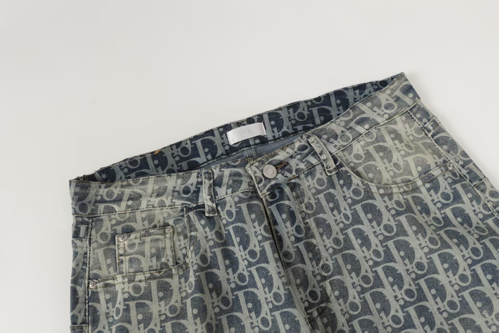 Oblique All-Over Print Faded Denim Jeans | Blue